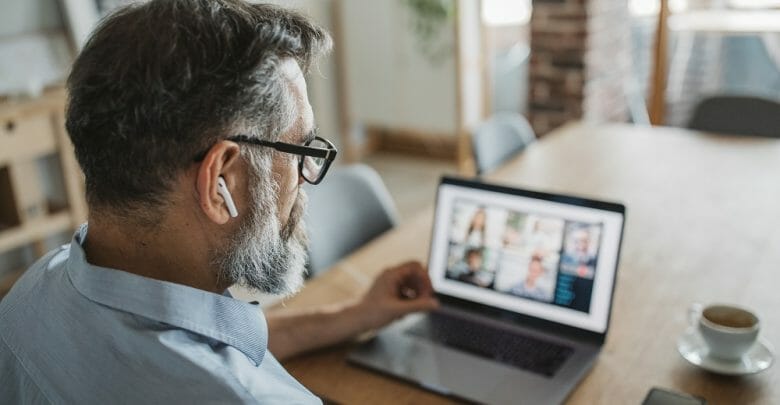 Mature men at home during pandemic isolation have conference call